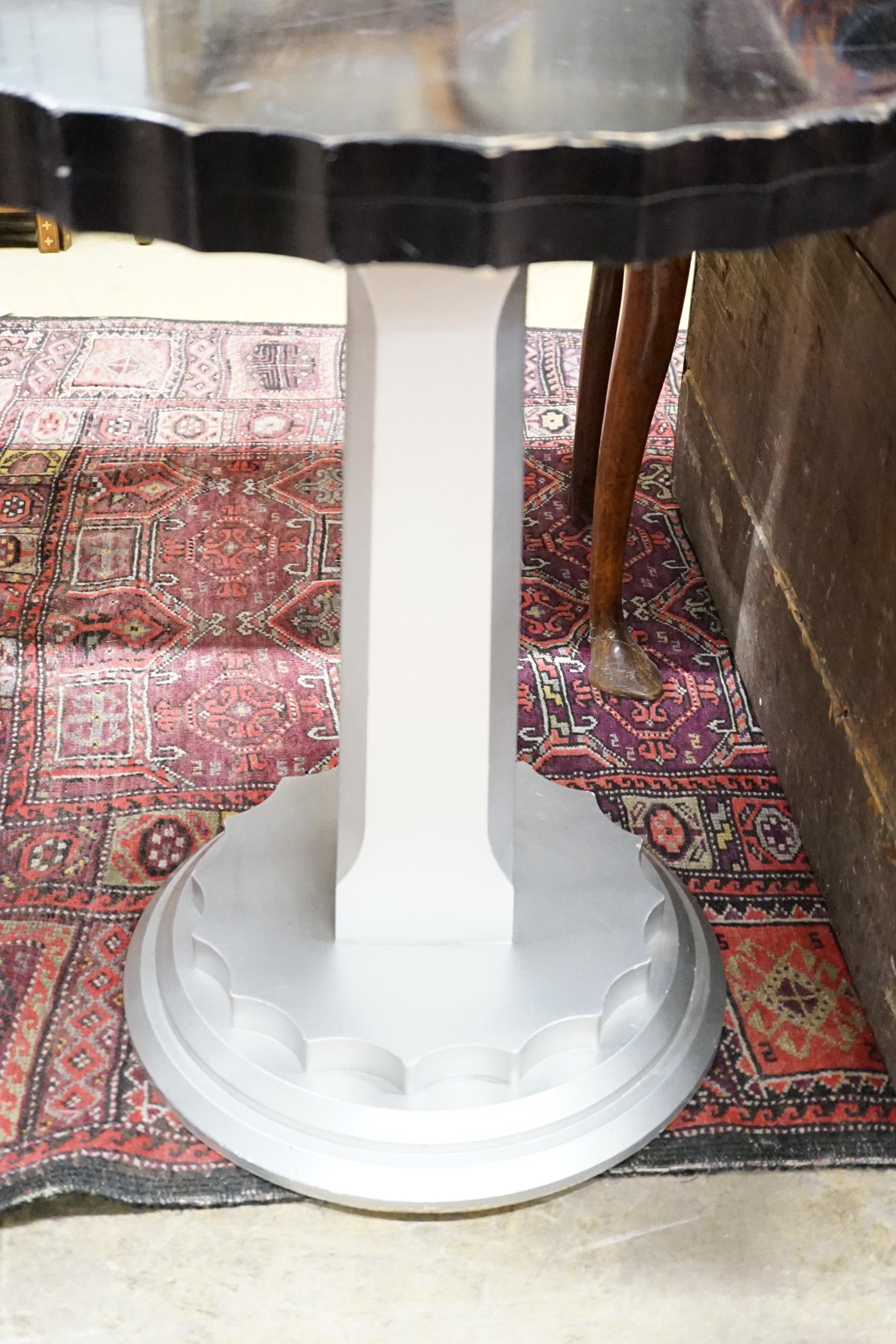 A pair of Art Deco ebonised and silvered wood occasional tables, diameter 60cm, height 71cm